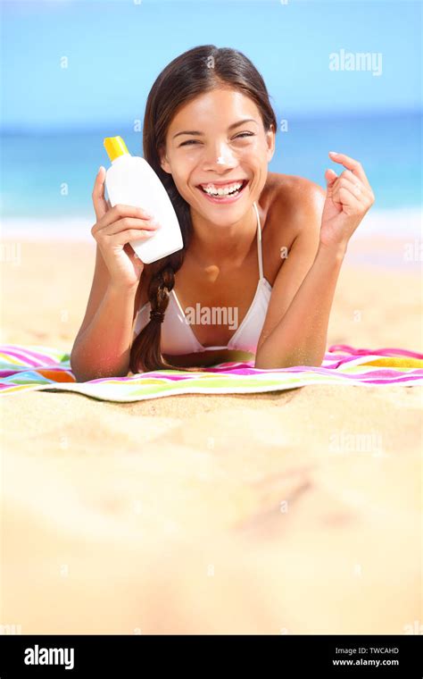 Sunscreen Woman Showing Suntan Lotion Bottle Applying Solar Cream To Nose Beautiful Smiling