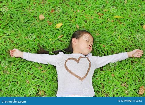 Cute Little Asian Child Girl Lying On Green Lawn Stock Image Image Of