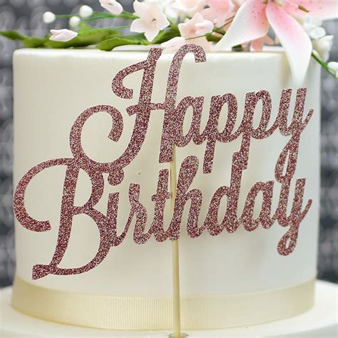 Birthday cake having rose on the top. Rose Gold Glitter 'Happy Birthday' Cake Topper