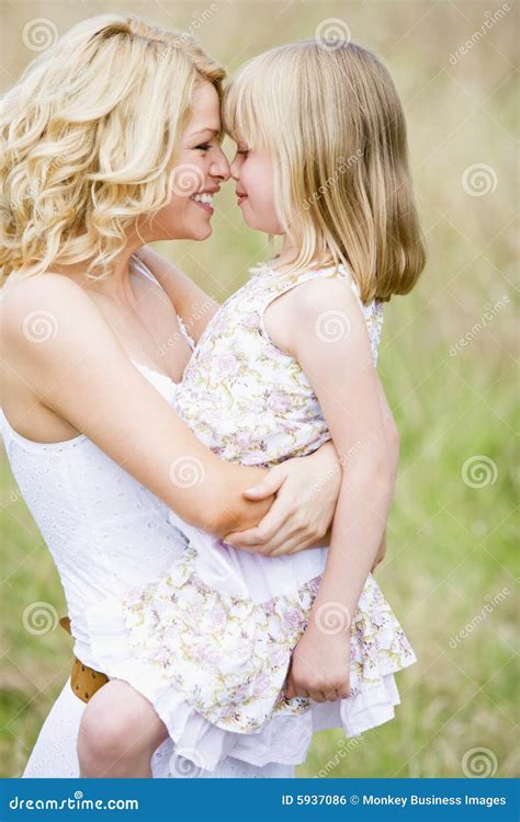 Mother Holding Daughter Outdoors Smiling Royalty Free Stock Image Image 5937086