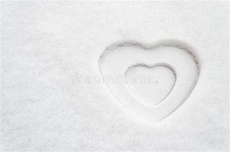White Heart Shape In Snow Texture With A Smaller White Heart Inside It