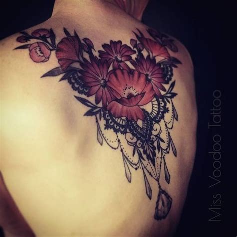 Big Modern Style Upper Back Tattoo Of Cute Flowers With Jewelry