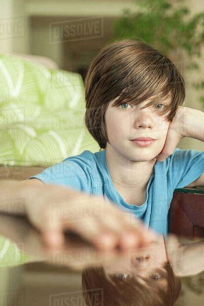 Teenage Boy Relaxing At Home Portrait Stock Photo Dissolve