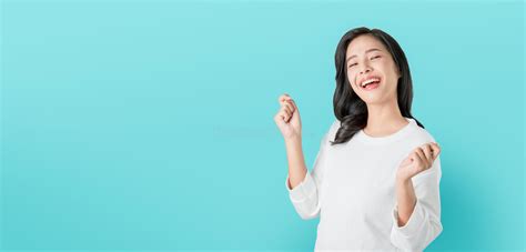 Cheerful Beautiful Asian Woman In Casual White T Shirt And Happy Face