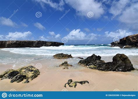 Stunning Aruba Seascape With Waves Crashing On The Beach Stock Photo