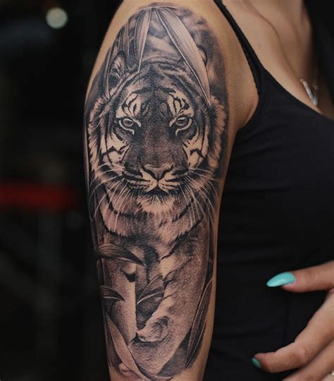 Beautiful Dark Grey Tiger Tattoo On Arm For Girls Done By