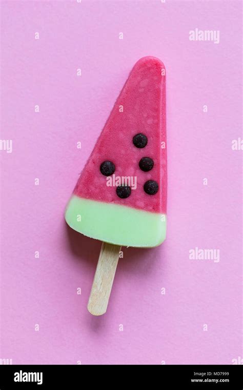Watermelon Shaped Summer Ice Lolly On A Pastel Pink Background Stock