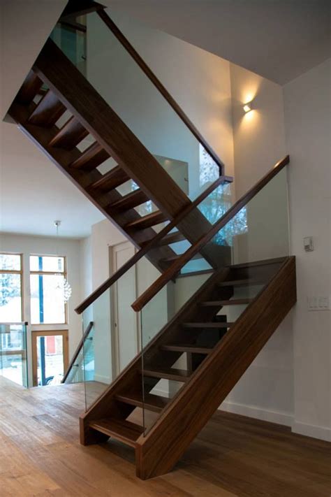 Walnut Freestanding Stairs With Open Risers And Glass Railings By