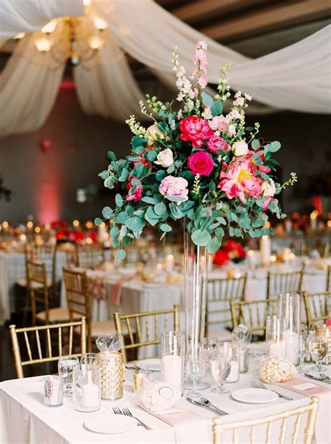 This stunning spring wedding bouquet features soft corals and a pop of bright pink to create a look that is whimsically feminine. A Sophisticated Spring Garden Wedding Tablescape | Spring ...