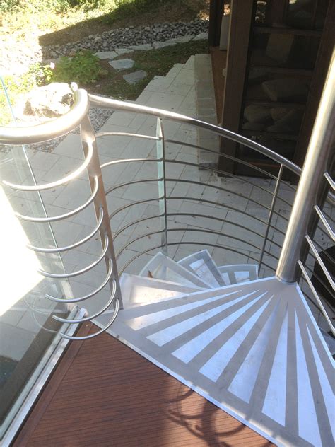 A sisal runner leads the way for guests on this smart, traditional staircase. Contemporary Stairs - Dekker Stairs