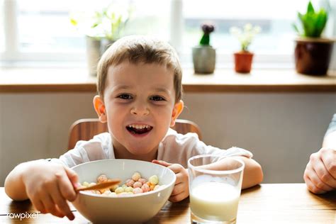 Little Boy Eating Breakfast Premium Image By Kids Milk