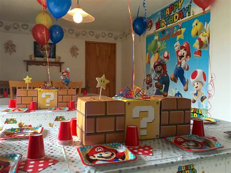 A Mario Birthday Party With Balloons And Decorations