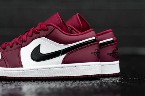 Noble Red Highlights This Air Jordan 1 Low •