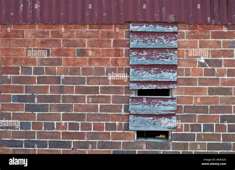 Old Red Brick Building With Boarded Up Window Stock Photo Alamy