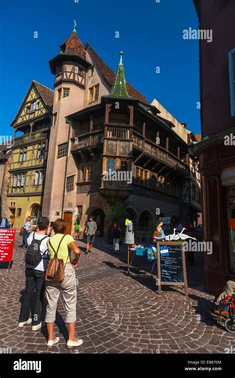 Tourists In Front Of The 16th Century Maison Pfister In Colmar Alsace