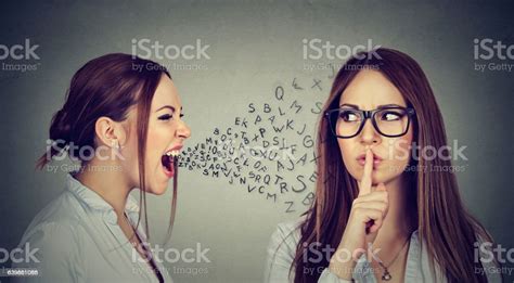 Angry Woman Screaming At Herself With Finger On Lips Gesture Stock