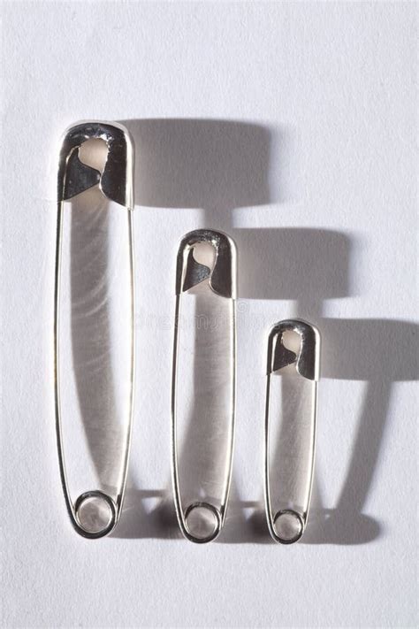Metal Safety Pins With Shadows Stock Image Image Of Spring
