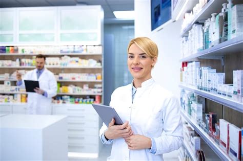 Premium Photo Portrait Of Beautiful Female Blonde Pharmacist Standing In Pharmacy Shop Or