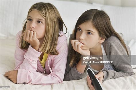 Two Girls Watching Television High Res Stock Photo Getty Images
