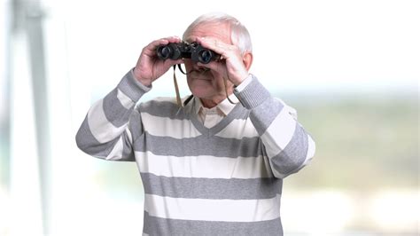 Senior Man Looking Through Pair Of Stock Footage Sbv 328239629