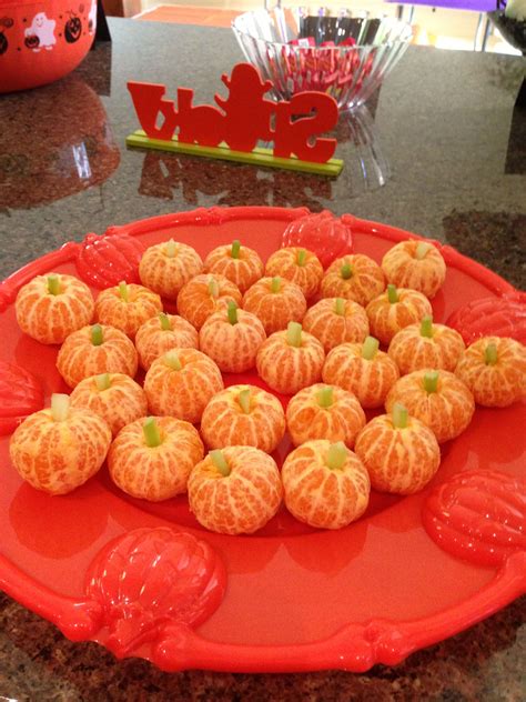 Mandarin Oranges With Celery To Look Like Pumpkins For Halloween Party