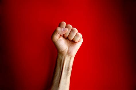 Angry Clenched Fist On Red Background Stock Photo Download Image Now