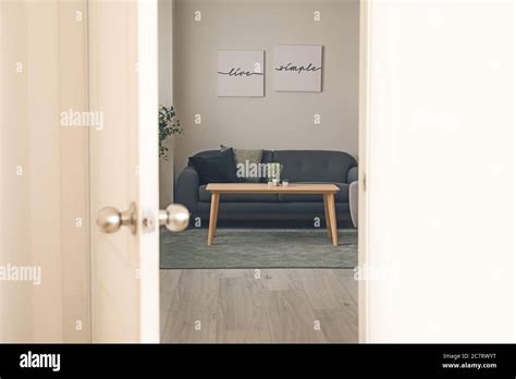View Of Living Room Through Open Door Stock Photo Alamy