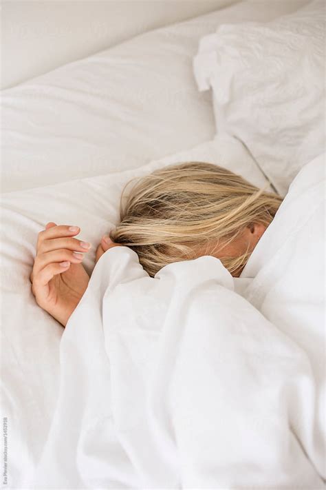 Blond Young Woman Sleeping On A Bed At Home Hoodoo Wallpaper