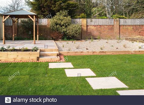 Laying a beautiful brick patio with this old house landscape contractor roger cook. Download this stock image: New stepping stones leading to ...