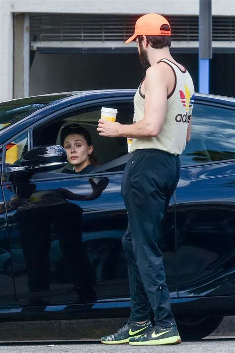 Maybe you would like to learn more about one of these? elizabeth olsen waits in the car while robbie arnett get ...