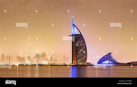 Stunning View Of The Illuminated Dubai Skyline During Sunset With The