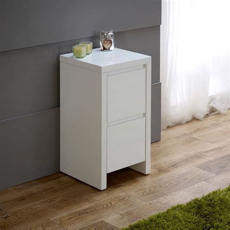 From holding your books and alarm clocks to styling a corner with a lamp, bedside tables are a modish solution. White High Gloss Slim 2 Drawer Bedside Table Things I like Side tables bedroom, White gloss ...