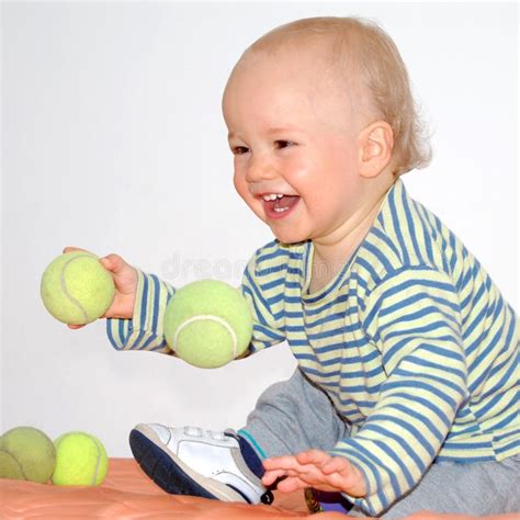 Happy Baby Plays Tennis Balls Stock Photos Free And Royalty Free Stock