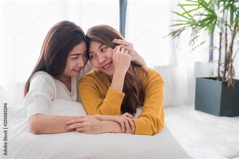 Asia Lesbian Lgbt Couple Hug And Lay On Bed Near White Window Sunlight With Happiness Moment