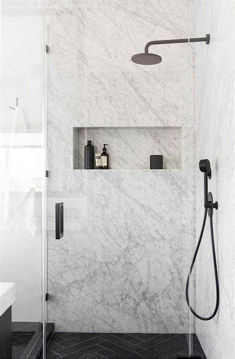 Slab Marble Shower With Horizontal Niche And Black Fixtures Bathroom