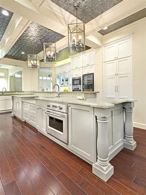 More is more with beams and panels. Cottage Kitchen with Ceiling Beams | HGTV