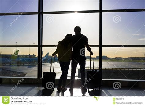 Couple Waiting For Flight In Airport Stock Photo Image Of Glass