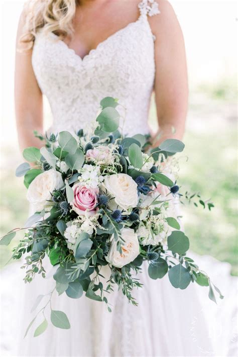 20 beautiful spring wedding bouquets with timeless style. Eucalyptus, blue thistle, and rose bouquet | Pink rose ...