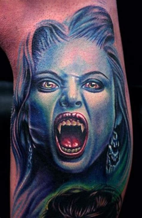 Very Realistic Looking Colored Evil Vampire Woman Tattoo On Leg