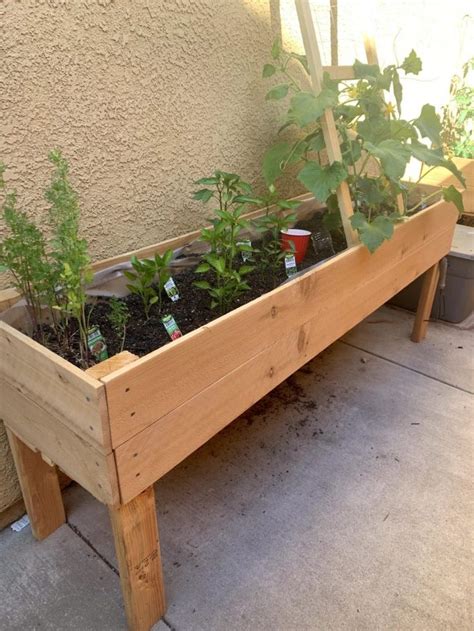 With spring right around the corner we're already putting our outdoor planting strategy in place. DIY Raised Planter Box | Carefully Clever in 2020 | Raised ...