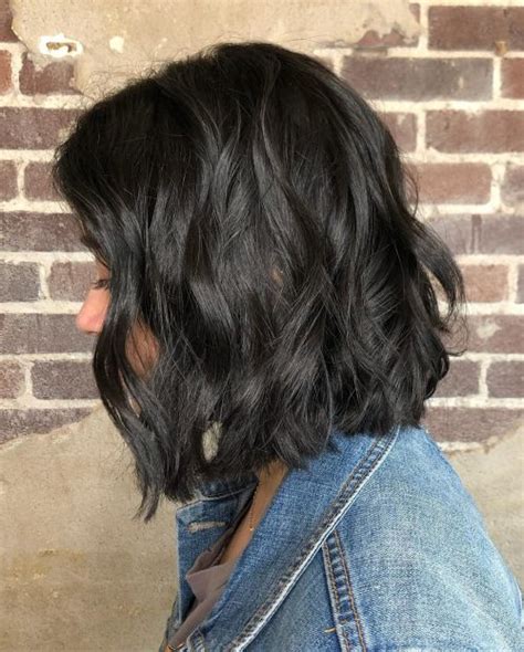 Achieve the ultimate in cool chic by gently teasing the hair at the roots for a 'bed hair, don't care' finish. 55 Cute Haircuts for Thick Hair for Any Length in 2020