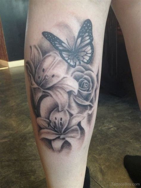 Realistic Butterfly And Flowers Tattoo On Back Leg Feminine Tattoos