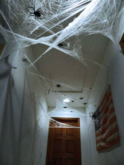 This giant outdoor spider web decoration is an easy diy halloween decoration idea for your front yard or porch. Halloween Hallway Decoration Ideas | Ultimate Home Ideas