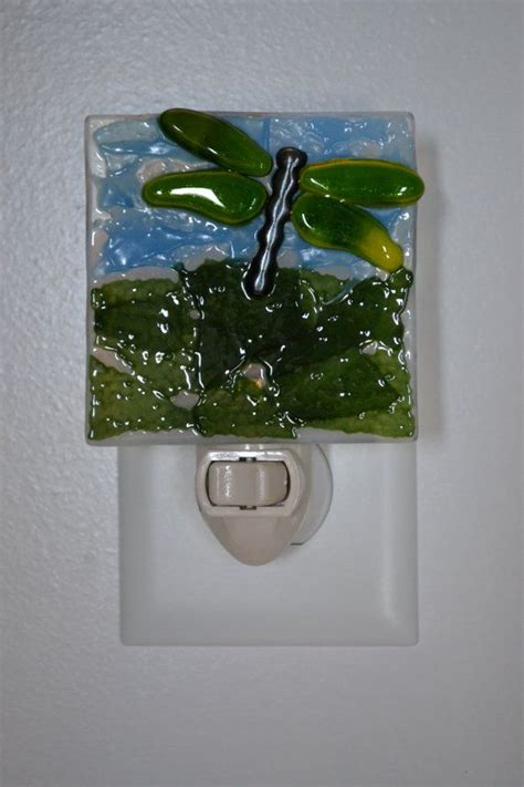 This Fused Glass Night Light Features A Green Dragonfly Flying Across The Surface Of The Glass