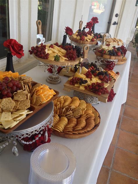 Cheese And Cracker Display Wedding Appetizers Red Flowers Wedding
