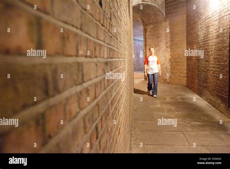 A Person Walking Through A Tunnel Hi Res Stock Photography And Images