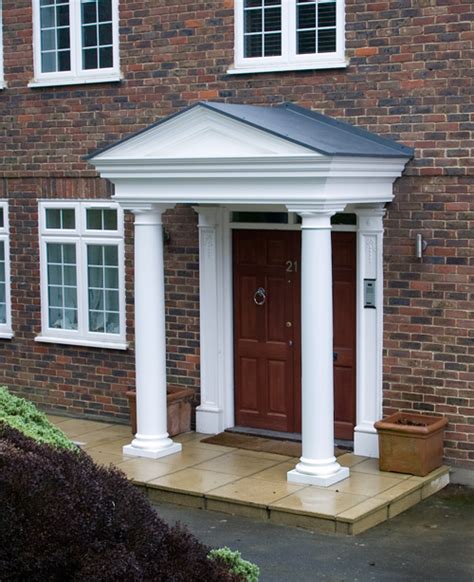A dual pitched grp canopy with moulded décor. GRP Door Surrounds | Fibreglass Porches | UK