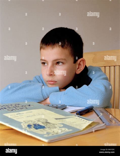 Bored Boy Doing His Homework Stock Photo Alamy