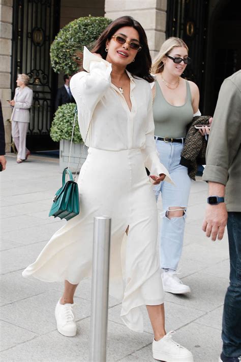 Priyanka Chopra Puts Trendy Finish On Thigh High Slit Skirt And Breezy Blouse With White Sneakers