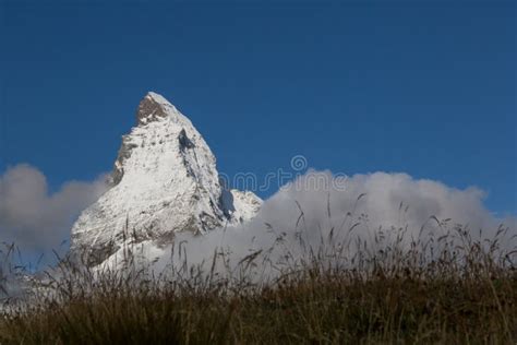 Snow Covered Top Of Matterhorn Mountain In Deep Blue Sky With Me Stock